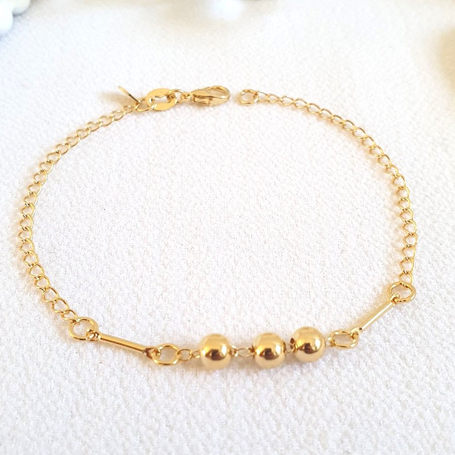 PULSEIRA FEMININA COM TRÊS BOLINHAS LISAS