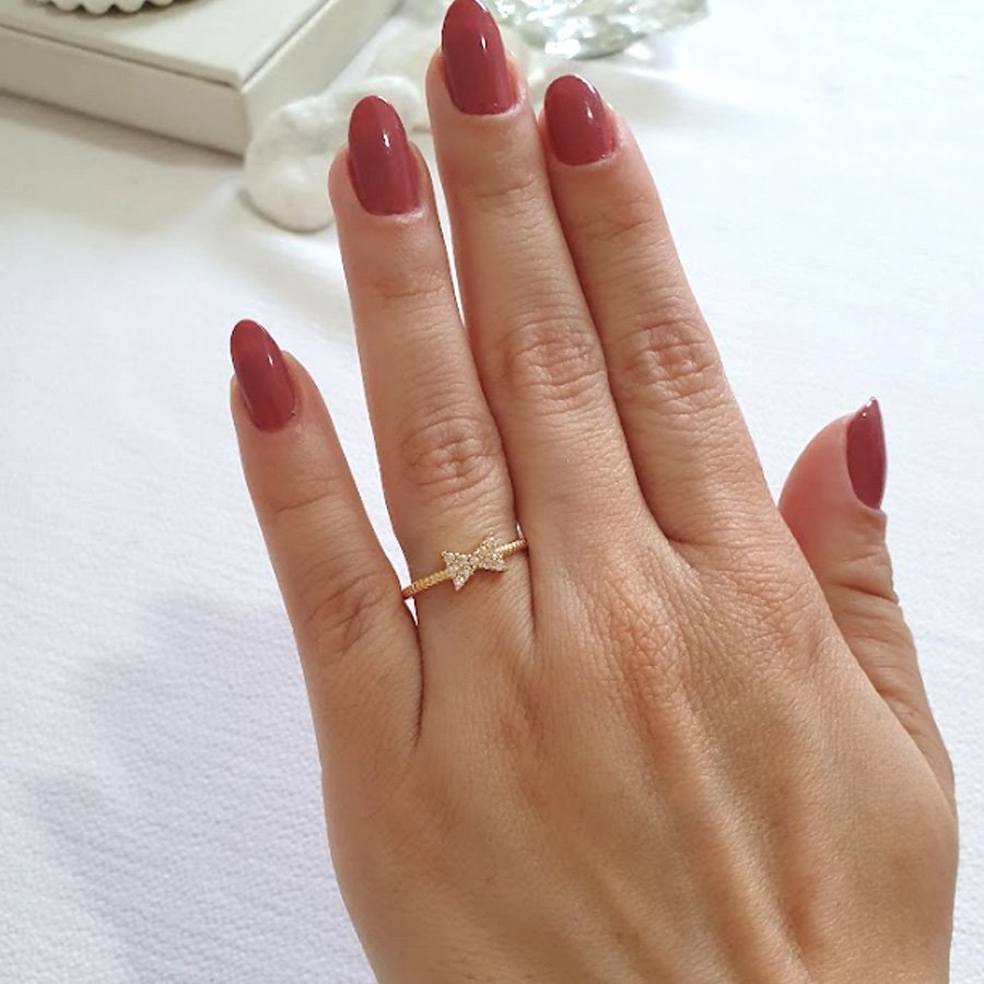 ANEL TRANÇADO COM LAÇO CRAVEJADO