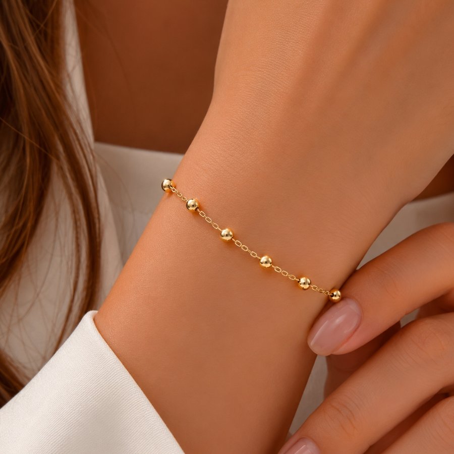 PULSEIRA FEMININA COM BOLINHAS OCA LISAS
